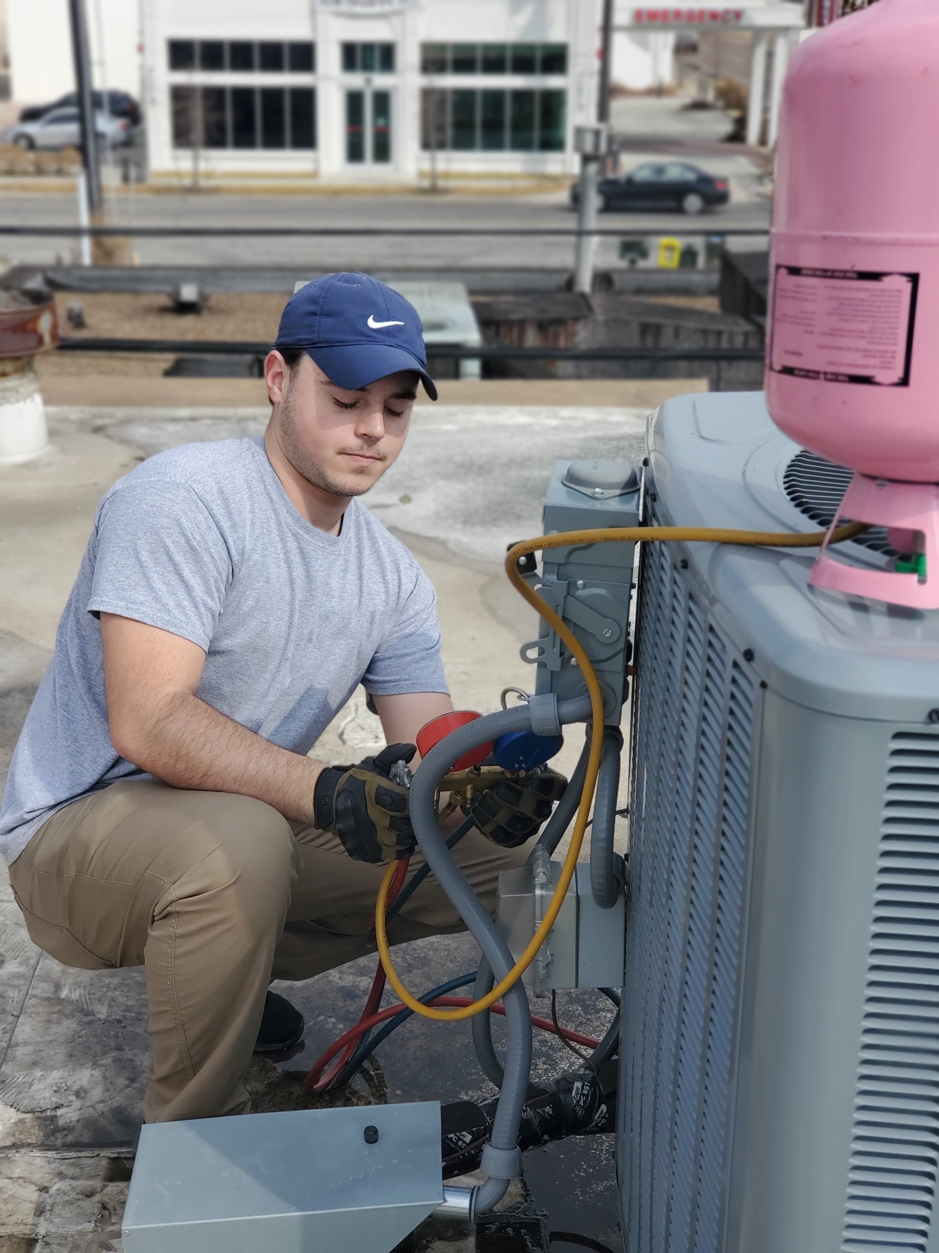 HVAC technician performing preventative maintenance