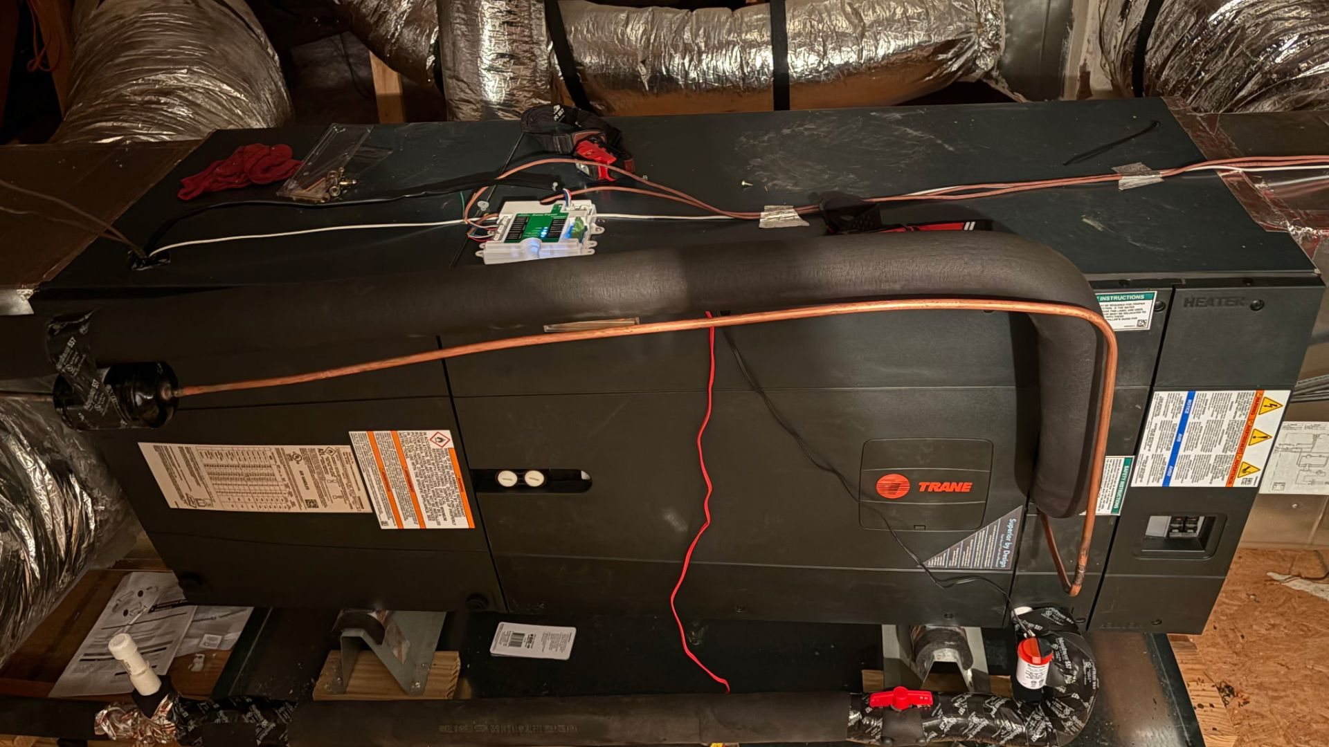 Row of packaged rooftop HVAC units on a flat commercial roof